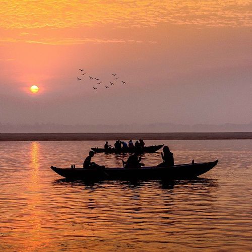 Small boat floating on calm water