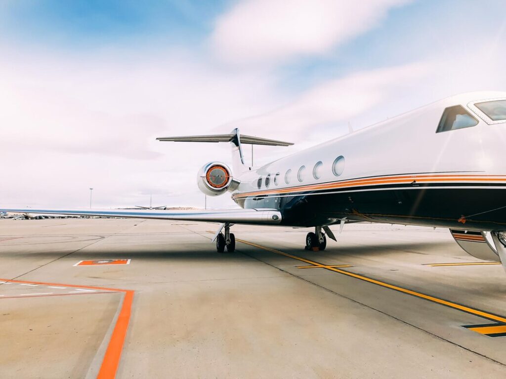 Private luxury jet parked at airport terminal